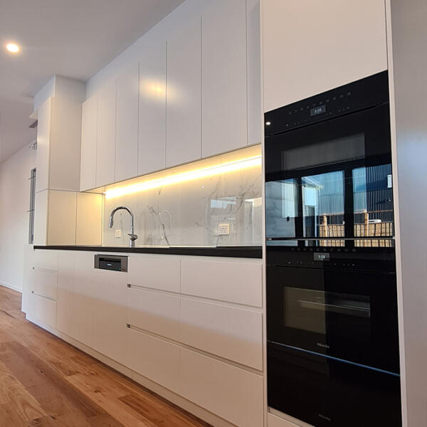 Kitchen in rammed earth home built by Michael Limb Builders, Point Lonsdale